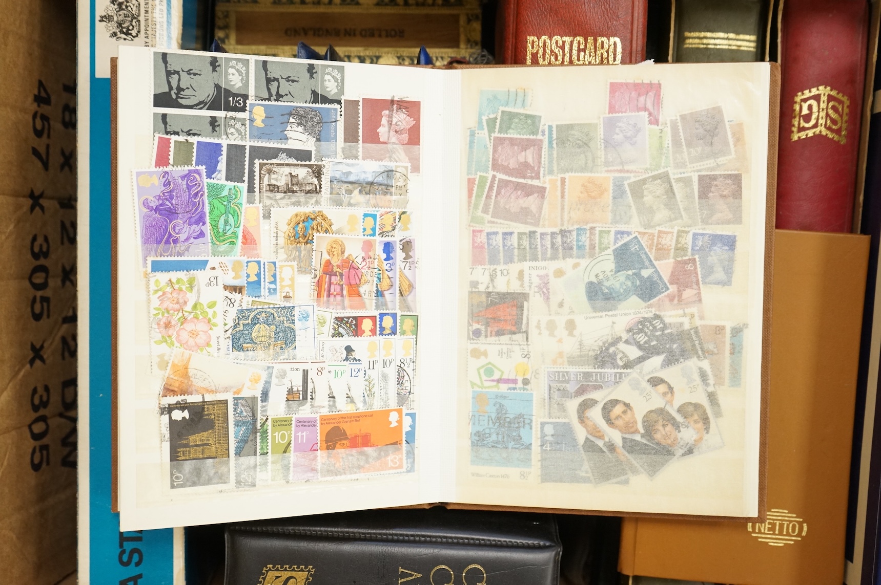 A collection of various stamps, mostly in albums